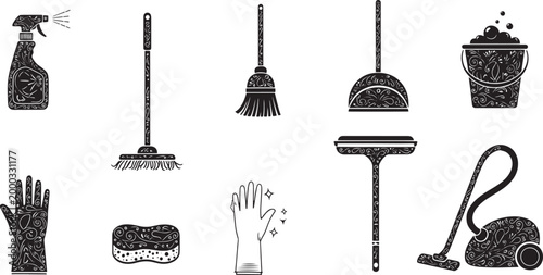 Black cleaning tools with ornate decorative patterns on white background spray bottle broom