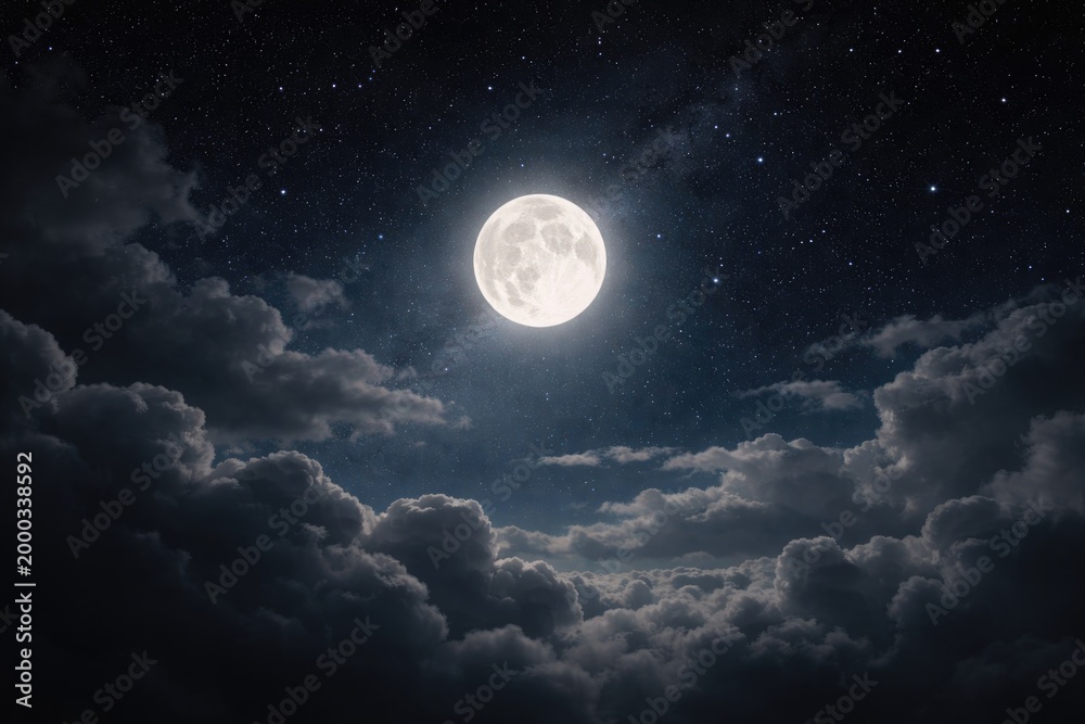 Fototapeta premium Full moon glowing softly above cloud cover with stars scattered in night