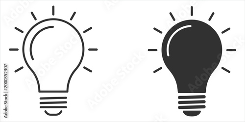 Two light bulb icons one outlined and one solid black representing ideas and innovation concept creativity