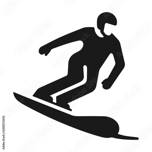 Snowboarder carving down the slope enjoying winter sports.
