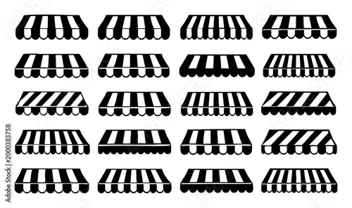 Awnings in a collection of black and white striped designs, including vertical and diagonal patterns, providing shade for storefronts