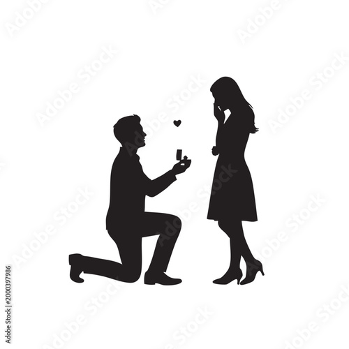 Man proposing to woman with engagement ring black and white proposal