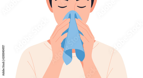 Man with closed eyes, blowing his nose with a blue handkerchief, isolated on white background