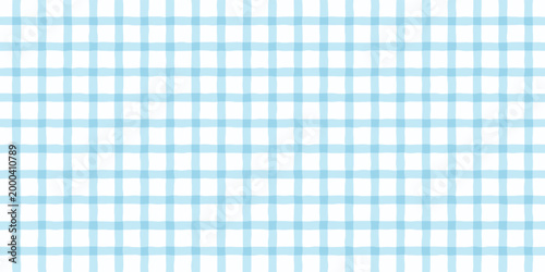 Light blue watercolor adding a soft, textured touch to a seamless gingham plaid pattern, creating a gentle and aesthetic background