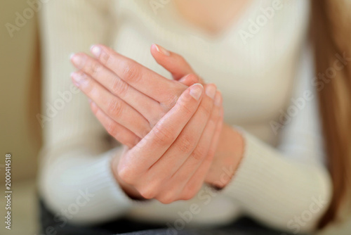 Fotografija Rubbing Hands After Applying Moisturizer