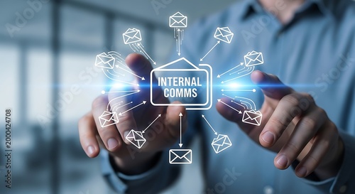 Businessman interacting with a digital interface displaying an internal communications network with email icons radiating from a central hub.
