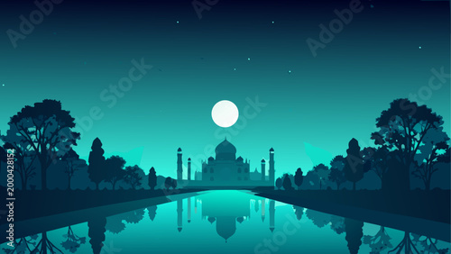 Full moon over calm lake with trees at night