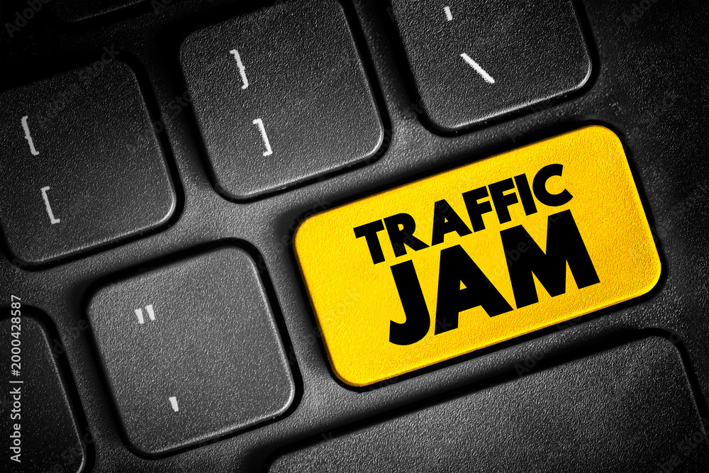 Obraz premium Traffic Jam is a long line of vehicles that cannot move forward because there is too much traffic, text button on keyboard, concept background