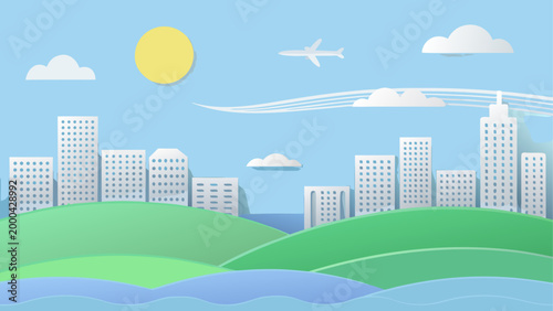 Hot air balloon flying over city skyline with green fields