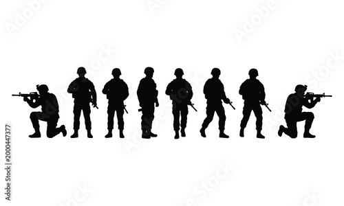 Silhouette soldiers in various poses, some kneeling with rifles, others standing alert.