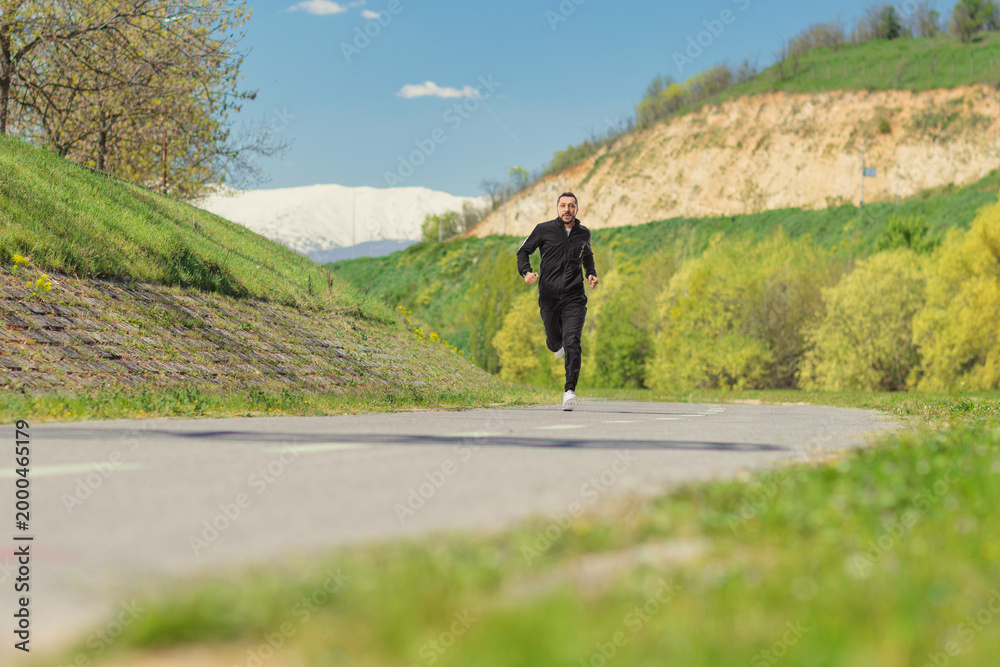 Obraz premium Man in tracksuits running