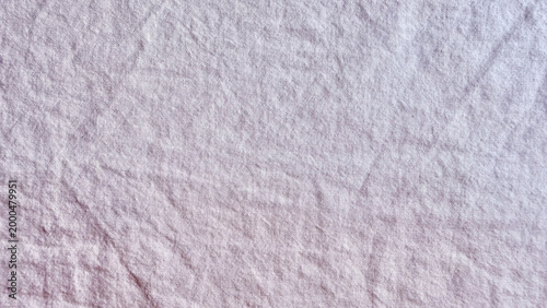 textured washed lavender purple cotton linen fabric surface backdrop with natural wrinkles and rumpled creases for organic rustic textile design