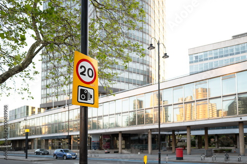 Картината върху платно Shallow focus of a typical 20 mph speed enforcement sign seen together with a warning of traffic cameras