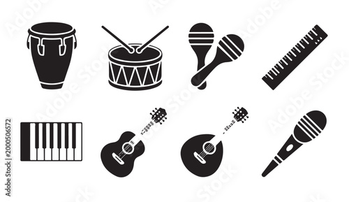 Black silhouette collection of musical instruments featuring drums maracas and keyboards.
