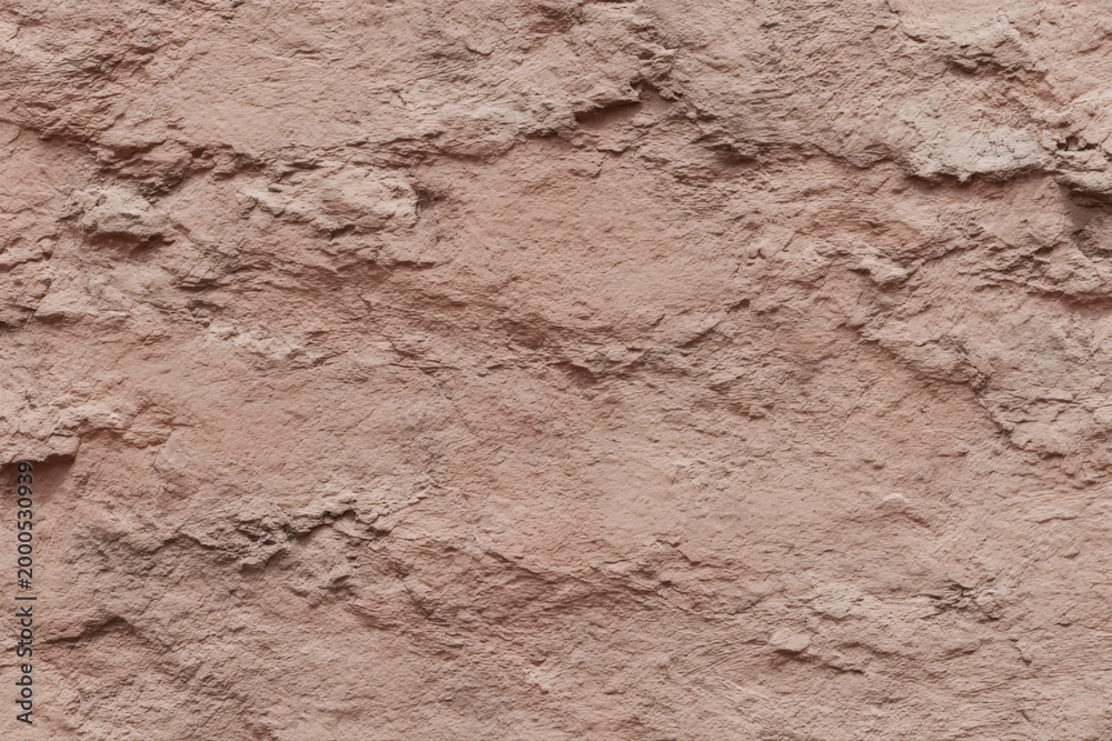 Fototapeta premium Close Up Rough Textured Reddish Brown Tan Clay Soil Rock Surface with Cracks Ridges Erosion Natural Geological Pattern