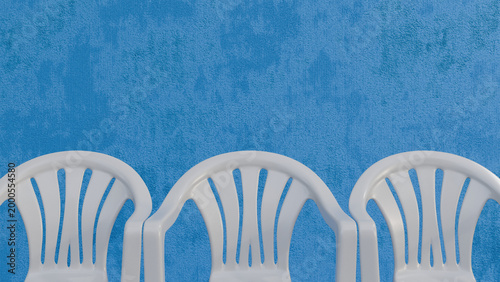 Minimal White Plastic Chairs on Blue Background with Copy Space, Empty Waiting Chairs Concept…