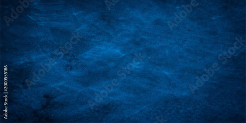 Abstract blue water surface, evoking a sense of tranquility. The deep blue color suggests depth and mystery. The image could be used to symbolize a vast ocean, calm lake.