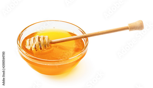 Εκτύπωση καμβά Golden honey in glass bowl with wooden dipper