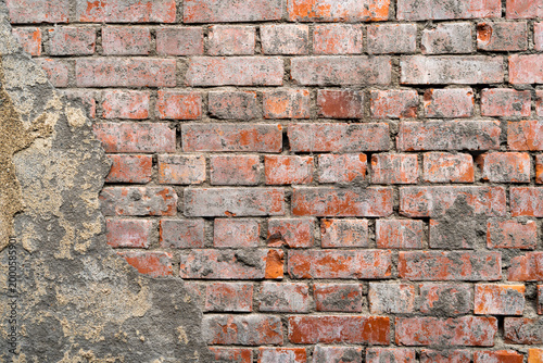 Grunge old and crack red color brick pattern wall textured background.