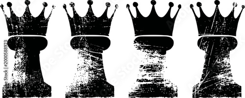 Four distressed black chess king pieces with crowns on white background