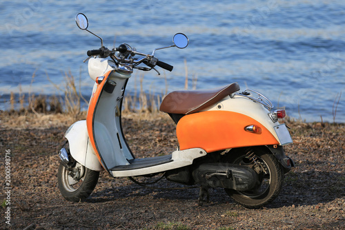an old rare motorcycle in the park