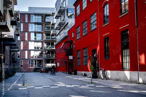 Photography Street in new residential area with luxury car and people and bicycle, Østerbro, Denmark