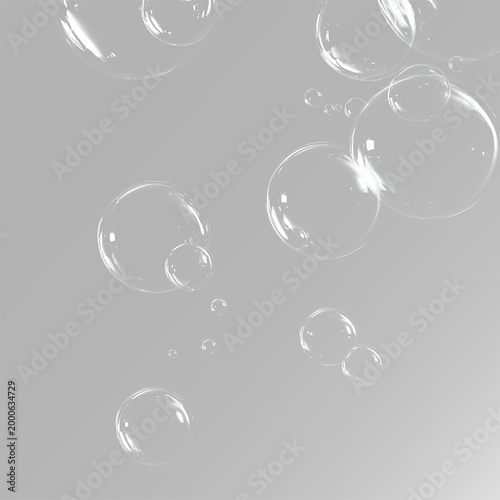 Foto Floating soap bubbles set with transparent liquid spheres and air