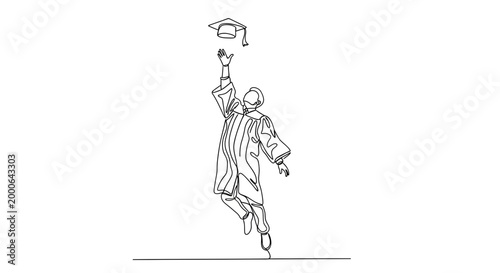 Man throwing graduation cap in air.