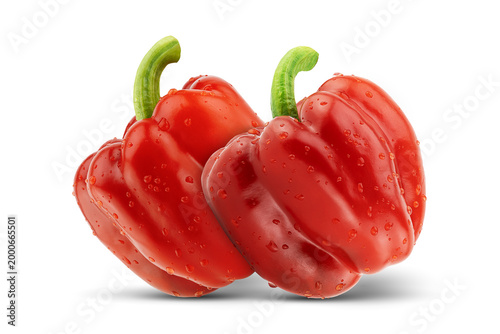 Two fresh red bell peppers on white background with clipping path