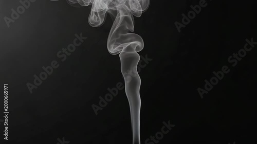 Thin rising smoke trail on black background