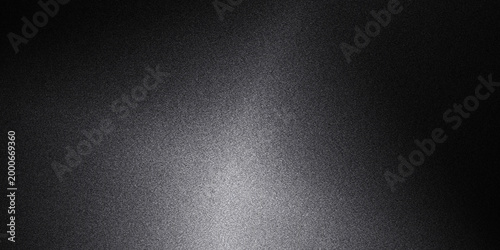 Gray gradient background with light shining down on a dark surface  seamless texture