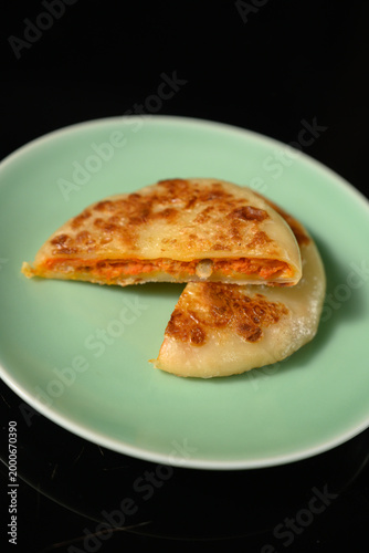 The delicious Orleans chicken pancake on the plate on the table