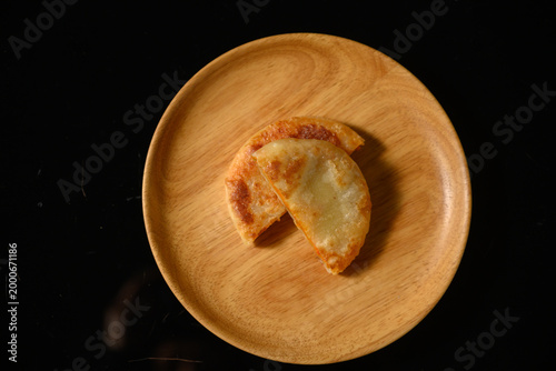 The delicious Orleans chicken pancake on the plate on the table
