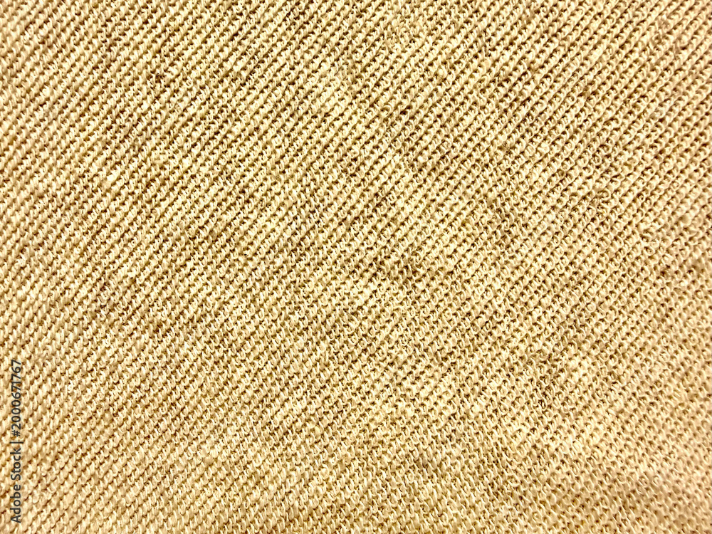 Fototapeta premium closeup beige burlap fabric texture with diagonal weave evoking rustic warmth and natural elegance in minimalist composition