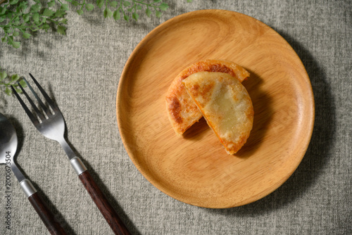 The delicious Orleans chicken pancake on the plate on the table