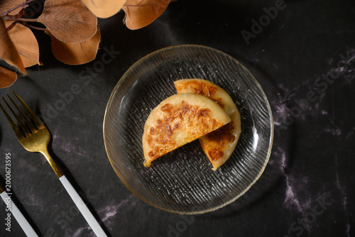 The delicious Orleans chicken pancake on the plate on the table