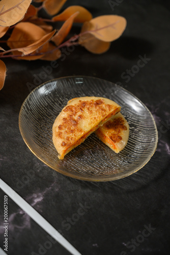 The delicious Orleans chicken pancake on the plate on the table