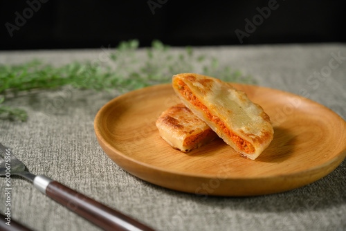 The delicious Orleans chicken pancake on the plate on the table