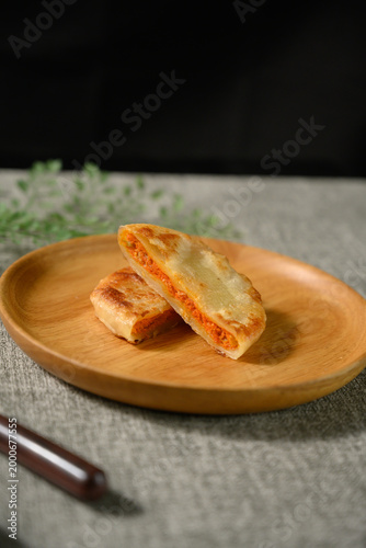 The delicious Orleans chicken pancake on the plate on the table