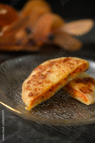 The delicious Orleans chicken pancake on the plate on the table