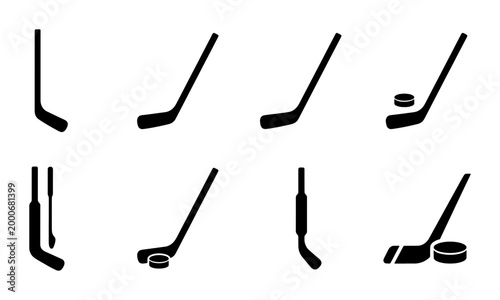 Canvas Print Ice hockey stick and puck icons set, black silhouette sports equipment collectio