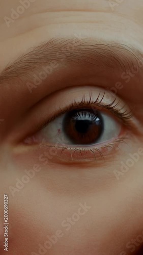Close-Up of a Human Eye: Captivating Details of Iris and Eyelashes in a Thoughtful Gaze