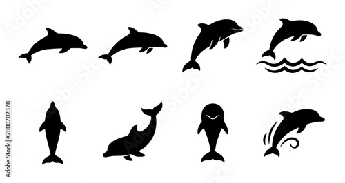 Fotografie Dolphin silhouette collection with 8 black vector icons, jumping sea mammal silh