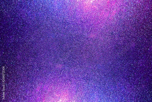 Black dark indigo blue gold orange glitter shiny abstract background for design. Twinkling glow stars effect. Fantastic, fantasy. Like outer space, night sky, universe. Grain, rough surface.