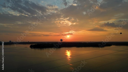 Sunset over Hietaniemi Beach in Helsinki, Finland with warm tones, calm sea, and peaceful coastal atmosphere.