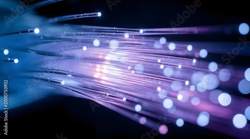 Macro close-up of fiber optic cables with blue and purple light refraction