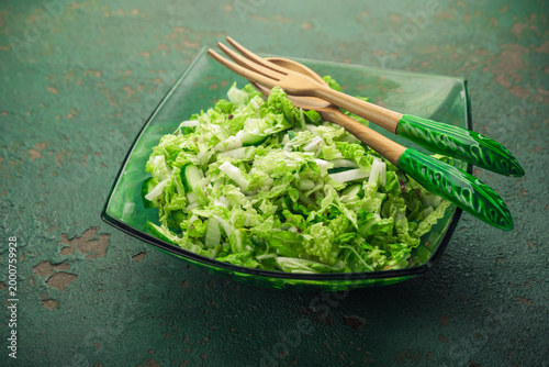 Tableau sur toile Fresh mixed green salad with Chinese cabbage, cucumber and avocado