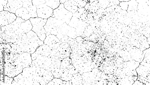 Cracked earth surface with small cracks and dirt specks texture background