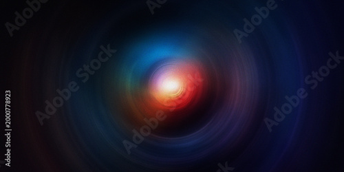 Colorful swirling light vortex on dark background, creating a bright and energetic abstract visual effect.