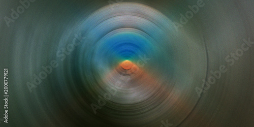 Cool abstract radial blur background with muted blue gray and orange tones creating a subtle and sophisticated atmosphere.